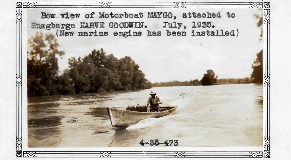 single man in a small motorboat in a river